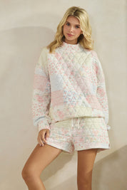 Floral textured mock neck sweater